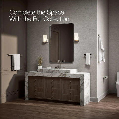 Bathroom with Composed Wall Mounted Pivoting Toilet Paper Holder in Vibrant Polished Nickel by a vanity mirror and sink