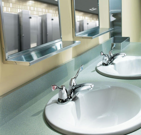 Commercial Two-Handle Centerset Lavatory Faucet With Drain In Chrome Finish, 4-Inch, installed in a high-traffic public bathroom.