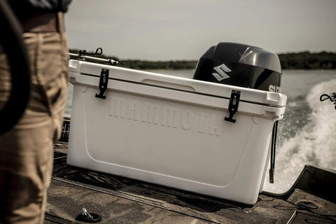 Bombproof 125 Quart Insulated Cooler Tough As Nails Rotomolded Hard Ice Chest on a boat with an outboard motor.