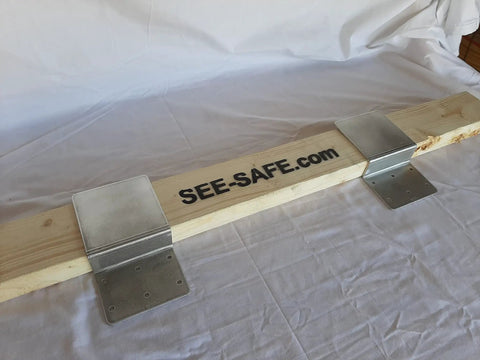 Heavy Duty Aluminum Door Reinforcement Brackets on a wood beam, 3 Inch Drop In Barricade Stopper that fits Standard 2x4 Boards.