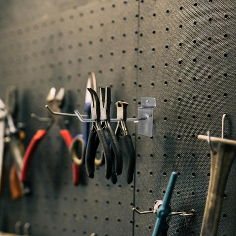 Slatwall Hooks For Phone Accessories, Heavy Duty 50 Pack Iron Pegboard Display Hangers holding tools on pegboard
