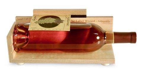 Adjustable Label Applicator Tool For Round Bottles Jars And Candles Slick Peel And Stick Positioner on a wine bottle
