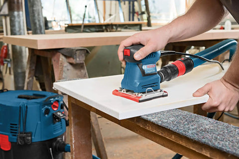 Person using GSS20-40 One Quarter Sheet Orbital Finishing Sander, Palm Sized, 2 Amp Motor, 12,000 OPM on wood surface