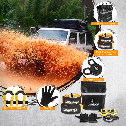 Beefy Off Road Winch Recovery Kit 8 Piece Set With 4x20 Tow Strap 4x8 Tree Saver 33000 Lbs Snatch Block Two Three Quarter Inch D Ring Shackles Recovery Gloves Winch Damper Storage Bag displayed in use with a Jeep on muddy terrain.