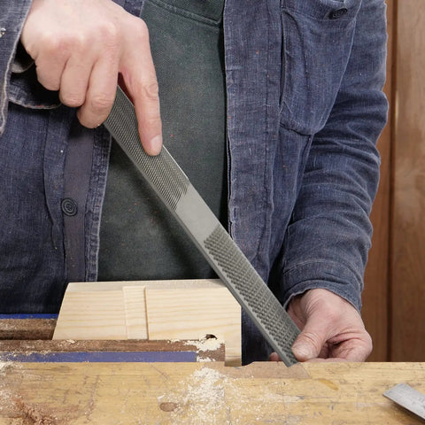 Workhorse 4 In 1 Wood Rasp File 8 Inch Straight Shooting Shaping Tool in use on wooden block during carpentry.