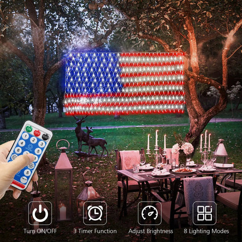 Solar American Flag Net Lights Outdoor 420 LEDs 6.5ft by 3.28ft displayed on tree with remote control