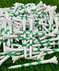 Four Leaf Clover Shamrock Golf Tees Bulk Pack Three And A Quarter Inch Plastic Tees White With Green Stripes Durable Usa Made 100 Count Perfect For Tournaments Practice Rounds And Gift Giving on grass.