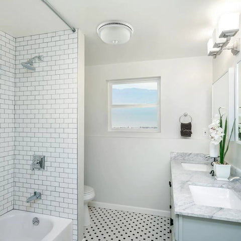 Bathroom interior with Decorative Round Bathroom Vent Fan With Light And Glass Globe, white ceiling, marble countertop, and tiled shower