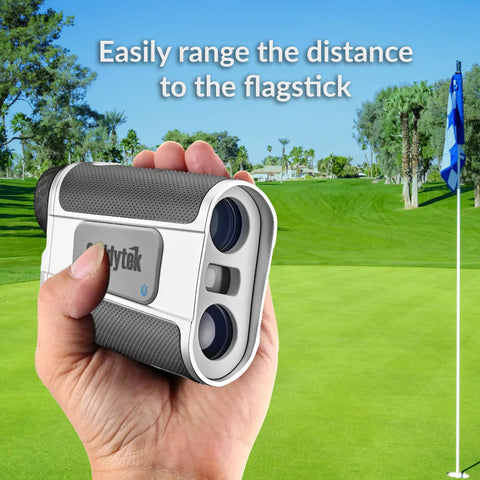 Handheld Golf Laser Rangefinder With Slope Compensation And Pin Flag Validation To Lock Down Precise Yardages On The Links For A Straight Shooting Round That Flows Smoothly in hand, measuring flag distance on a golf course.