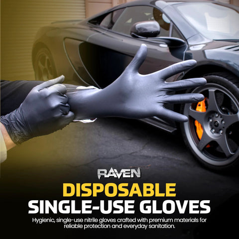 Close-up of Raven powder-free nitrile disposable glove being donned; black 7 mil latex-free with textured grip.