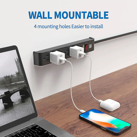Rock Solid Six Outlet Surge Protector Power Strip With Six Foot Extension Cord And Six Hundred Joule Defense For Bulletproof Home Office Gaming Workstation Setup mounted on wall.