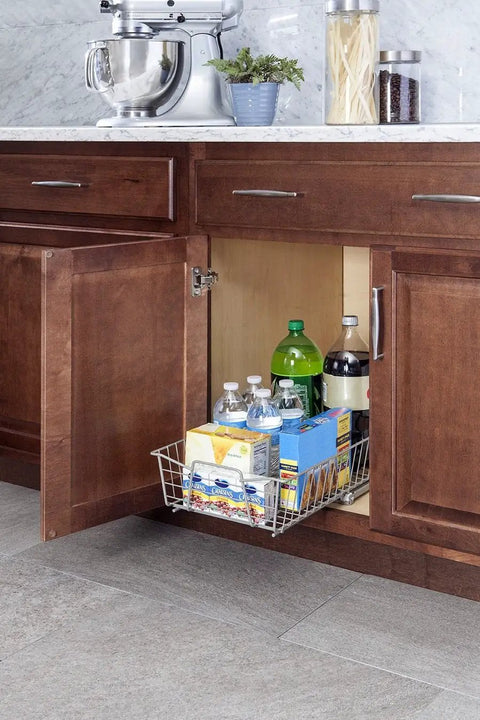 11 Inch Heavy Duty Slide Out Cabinet Organizer With Pull Out Pantry Shelf Drawer For Kitchen Bathroom And Laundry Room Nickel Smooth Glide Game Changer showing a cabinet with a pull-out basket of drinks.