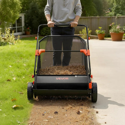 Heavy Duty Push Lawn Sweeper With 30 Inch Wide Broom And 12 Cubic Foot Hopper Bag For No Sweat Grass And Leaf Pickup Across Big Lawns Patios Sidewalks And Driveways in use on grass.