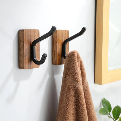 Rustic Wood Adhesive Wall Hooks Four Pack Heavy Duty Sticker Hangers Fits Coats Towels And Bags smooth design holding a towel.