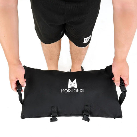 Person holding Two Pack 45 Lbs Heavy Duty Umbrella Base Sand Bags with 600D Oxford Fabric for patio use