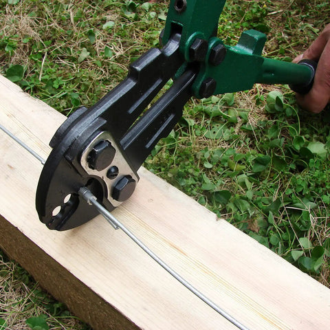 18 inch hand crimper from a 4 Slot Crimping Swaging Tool Kit for heavy duty high tensile wires and cables on wooden plank