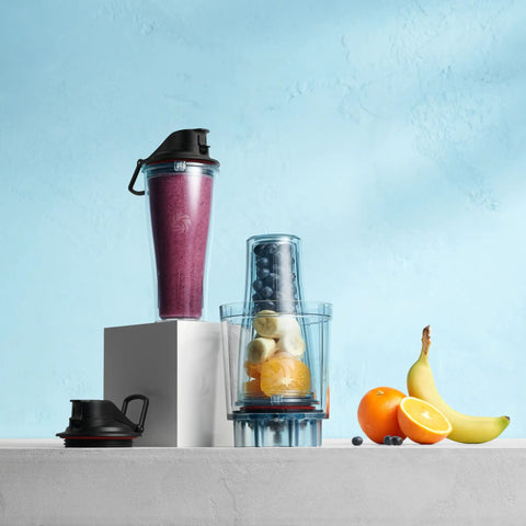 Personal Cup Adapter Kit For Full Size Blenders, BPA Free And Dishwasher Safe with two 20 oz cups shown with fruit blend
