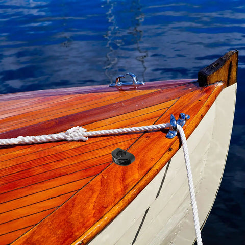 Boat deck with rope, featuring pair of large nylon kayak pulleys with rolling bearings for smooth wire guidance on boats canoes yachts.