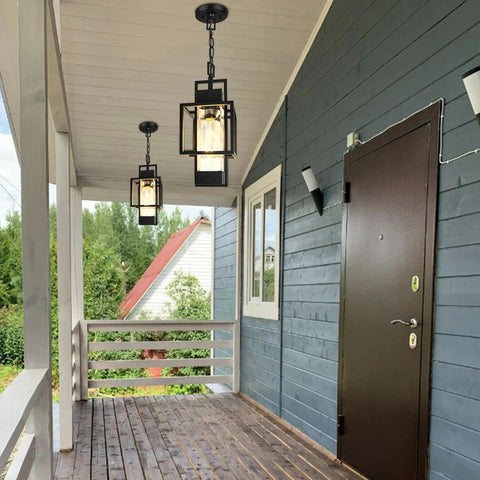 Top Shelf Modern Black Metal Motion Sensor Outdoor Pendant Light Slick Finish Exterior Hanging Lantern in porch setting.