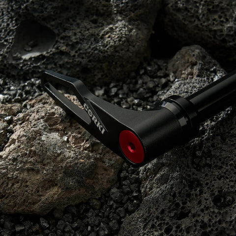 Thru Axle Adapter For Boost Forks, 1.0mm Thread Pitch, black handle on rugged stone background