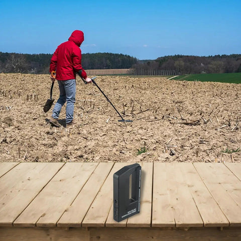 Solid Pick Handheld Wire Pipe Power Detector And Stud Finder Wall Scanner on wooden surface, with user scanning field.