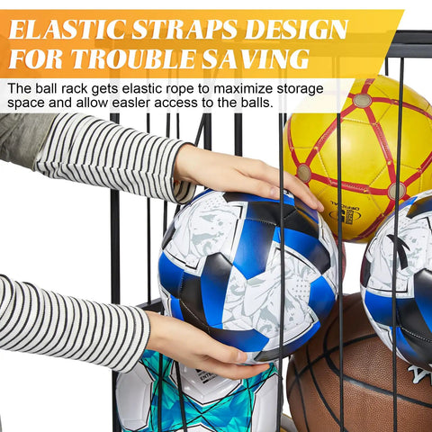 Hands placing a soccer ball into the Heavy Duty Garage Ball Storage Rack With No Fuss Elastic Strap Wall Mount Or Floor Stand Option For Basketball Soccer Football Volleyball Gear In Matte Black.