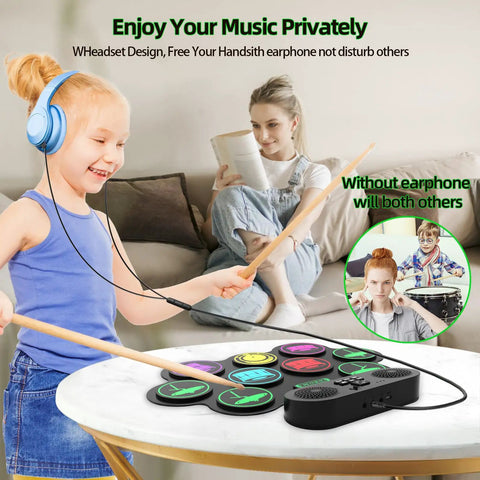 Child using Roll Up 9 Pad MIDI Electronic Drum Set With Headphone Jack Built In Dual Speakers on table, adult reading, headphones on.