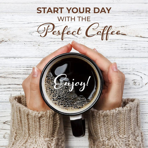 Hands holding a coffee mug on a wooden table with 'Start Your Day with the Perfect Coffee' text, cozy sweater visible.