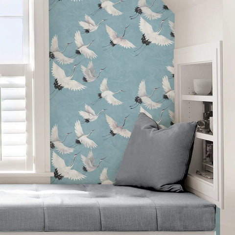 Blue Halcyon Crane Peel And Stick Wallpaper with cranes on blue background in room setting, 20.5 In by 18 Ft Roll
