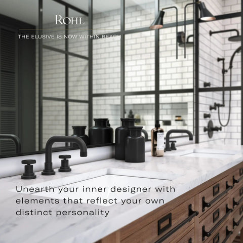 Modern bathroom with black fixtures and white marble countertop, featuring wooden cabinetry and large mirror with industrial lighting.