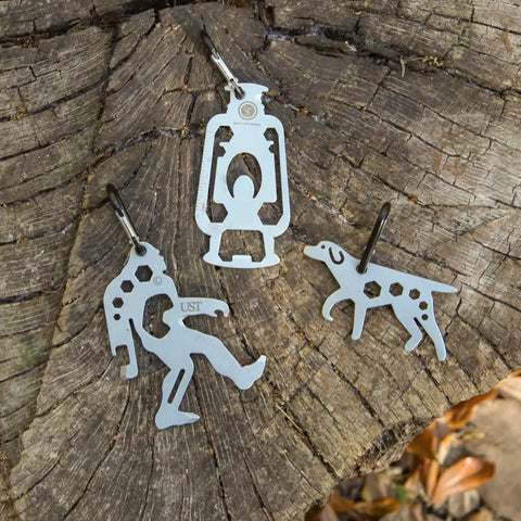 Ultra Compact Stainless Steel Long Multi Tool With Carabiner Clip Four Position Hex Wrenches on tree stump