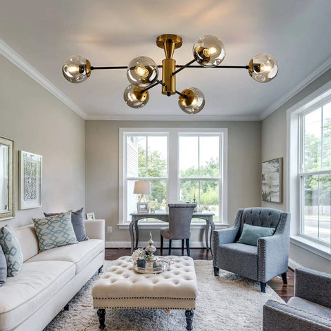 6-Light Sputnik Gold Ceiling Light Fixture With Glass Globe in living room with tufted ottoman and armchairs, mid-century style