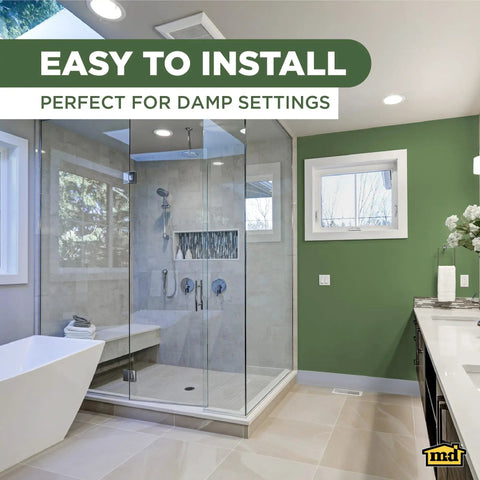 Corner view of modern bathroom with glass shower, featuring 4 Inch Dry Back Vinyl Wall Base With Flexible Toe Kick Trim 60 Ft Roll.