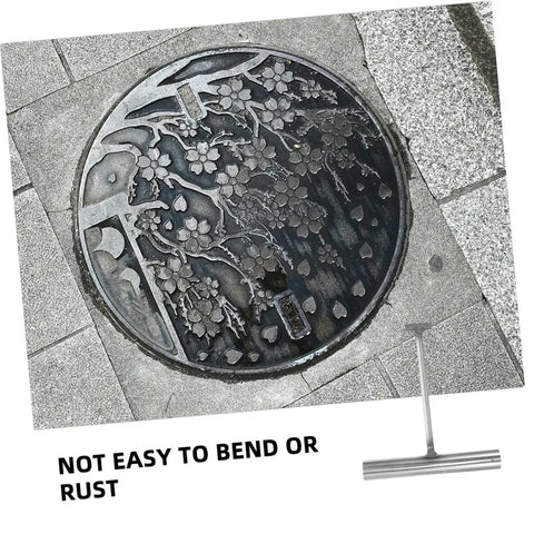 Pro Crew Heavy Duty Built Tough As Nails T Shaped Manhole Cover Hook 2 Pack Stainless Steel Drain Grate Lifter Tool on pavement.