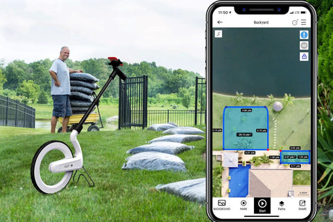 Rock Solid Digital Measuring Wheel And Smart Mapping Kit With Sprayer Attachment measuring grass area with app display.