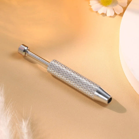 Piercing Ball Grabber Reacher Tool For Jewelry And Small Parts 4 Claw Stainless Steel Pickup Tool on beige background
