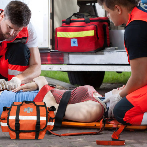 EMS professionals using Color Coded Backboard Spine Board Straps For Quick Immobilization On Stretcher 10 Point System