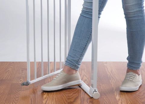 Flat Step Pressure Mounted Baby Gate For Doorways With Door, Easy No Drill Install, showing foot holding white gate open on wooden floor