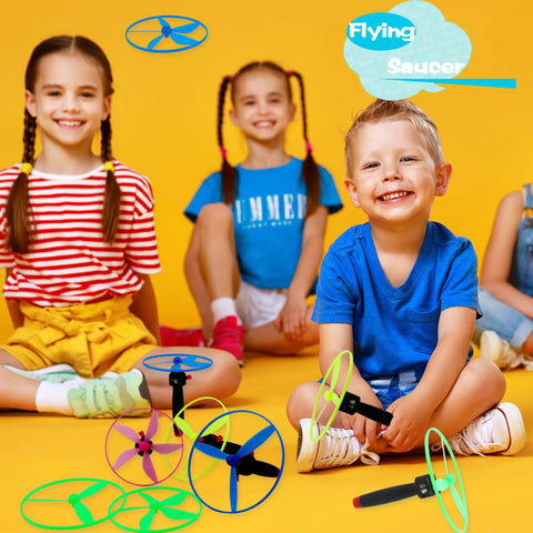 Kids playing with Awesome Flying Saucer Toy Set With 32 Discs And 16 String Launchers for backyard fun and party favors.