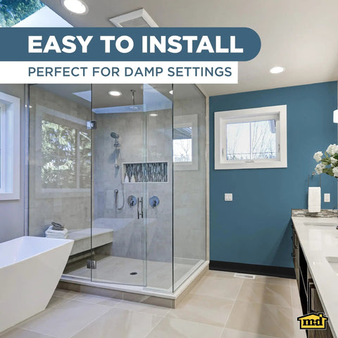 Self-Stick Vinyl Wall Base 4 Inch High By 20 Feet Long Black Flexible Vinyl Trim For Walls in a modern bathroom.