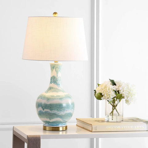 Green And White Striped Ceramic Table Lamp For Bedroom And Living Room Coastal Modern Bedside Light With Gold Base And White Linen Shade LED Bulb Included Measures 30.5 Inches Tall on table with books and flowers