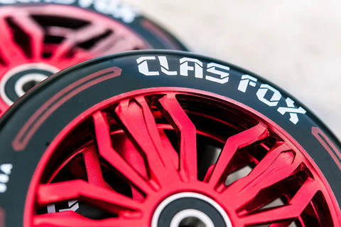 Real Heavy Duty Pro Scooter Wheels With Abec 9 Bearings 120 X 24 MM forged aluminum core with red design and black rubber.