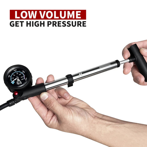 Hands holding Portable Bike Fork And Rear Shock Pump 400 PSI With 1.5 Inch Gauge Micro Air Adjust Button Swivel Hose compact size.