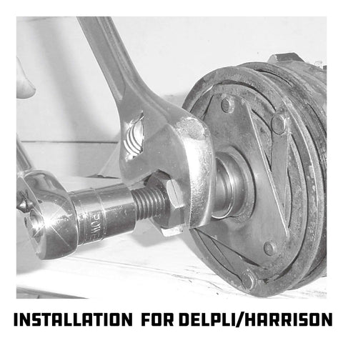 Close-up of AC Clutch Removal And Installation Tool Kit for Automotive Compressors in use, focusing on wrench interaction.