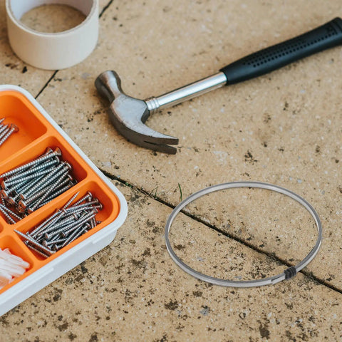 Premium Nickel Chromium Heating Element Replacement Strip for Heat Shrink Film Sealer alongside tools and screws on a work surface.