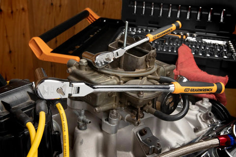 Two Piece Flex Head Teardrop Ratchet Set with 1/4 and 3/8 inch drives in use on automotive component, showcasing dual material handles.