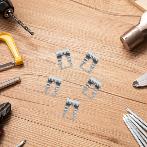 Universal Auto Windshield Wiper Linkage Repair Clips Kit Built Tough With Heavy Duty Stainless Steel displayed on a workbench.