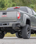 Lifted GMC truck showcasing suspension fit for N3 Rear Shock Absorbers Built Tough For Ford F150 2009 To 2024, 4 To 7.5 Inch Lift