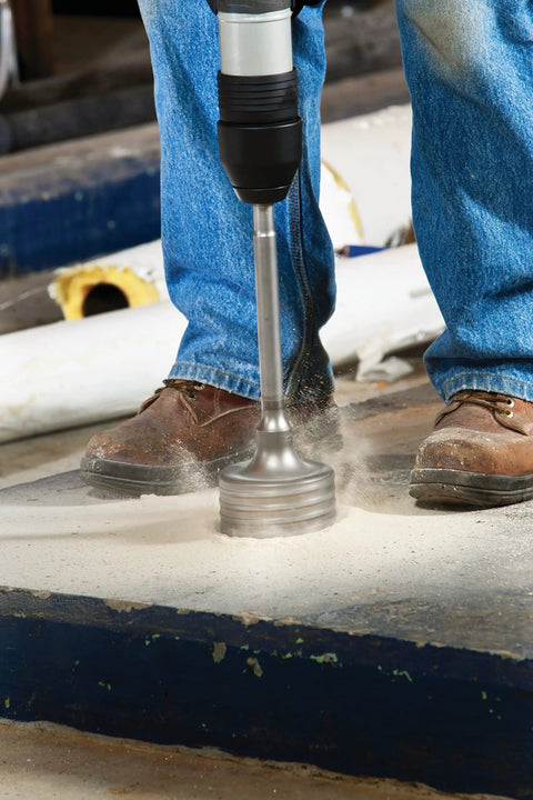 Worker using 3 9/16 Inch Rotary Hammer Core Bit Set With Wave Design Delivers Cleaner Holes Up To 6 Inches Carbide Tipped Centering Bit