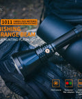 Long-Range Rechargeable Hunting Flashlight 1500 Lumen With 1011 Yards Reach on gloves and bag